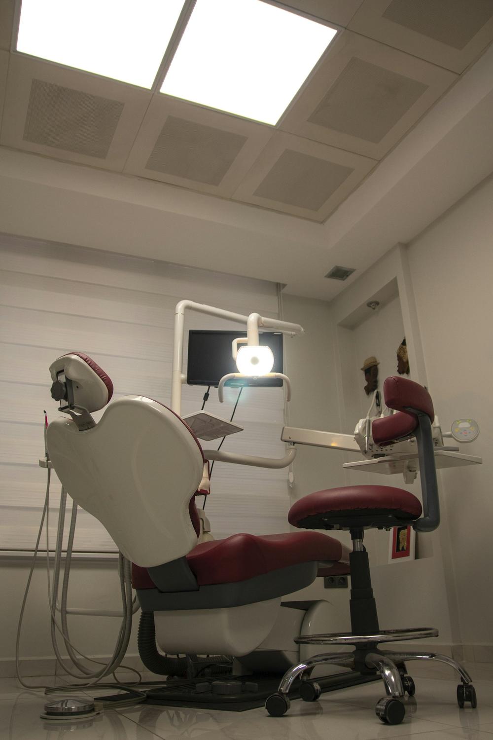 Private treatment room with a window and a modern dental chair